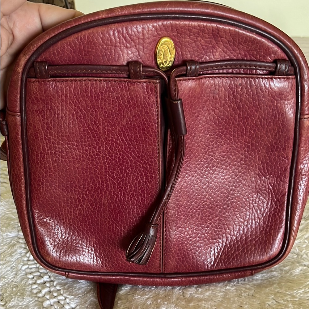 Cartier Crossbody Bag with Textured Leather and Zip Closure. Preloved